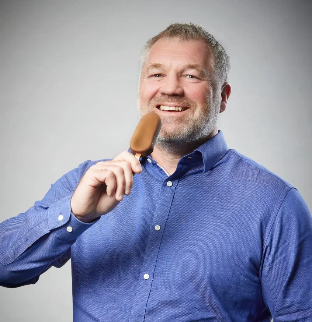 Smiling colleague with ice cream